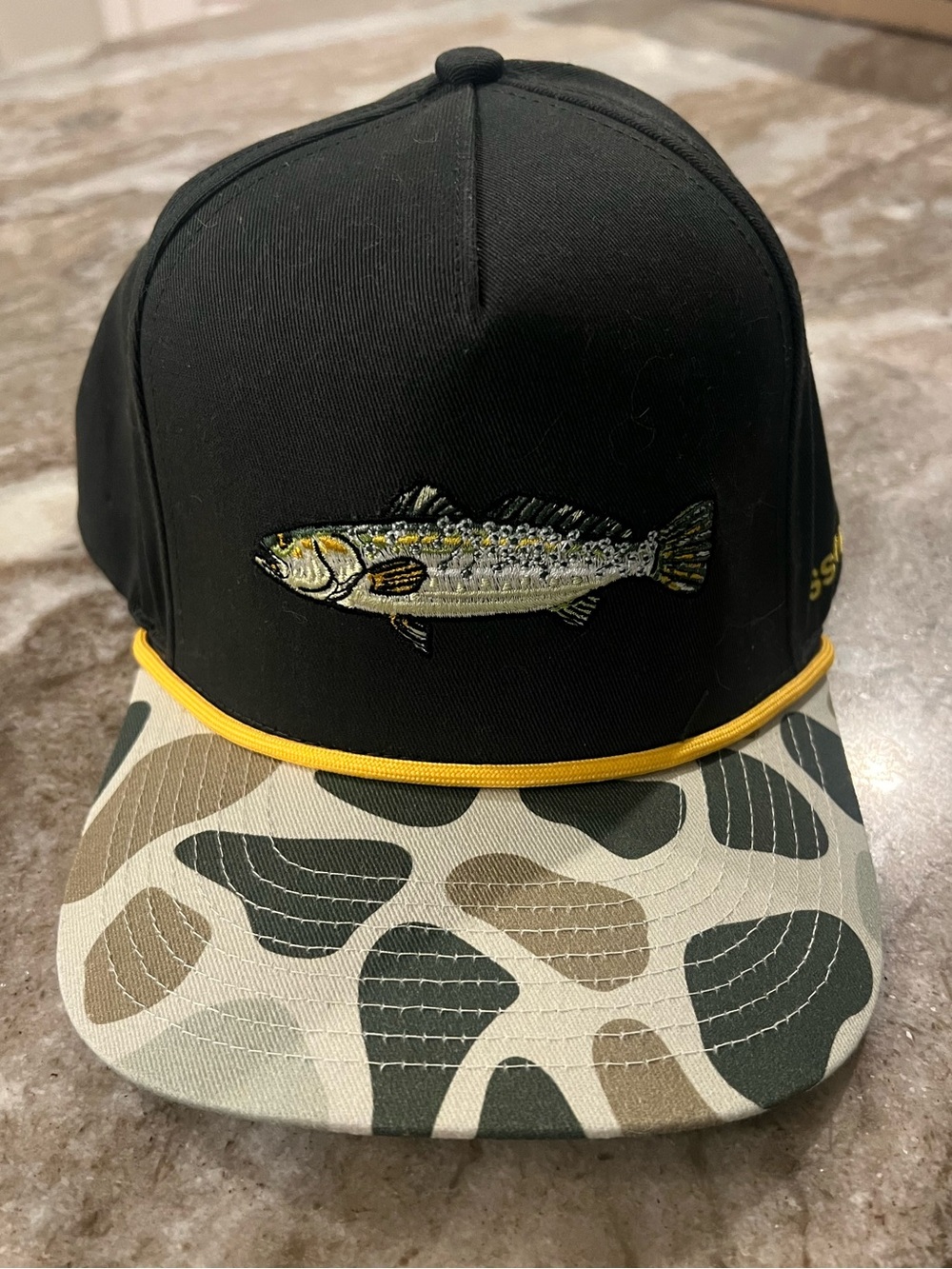 Black Fish Embroidered Snapback Hat with Camo Brim and Yellow Rope